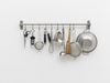 Hans-Christian Lotz. Untitled, 2017. Kitchen utensils, stainless steel rail. 42 x 80 x 15 cm

