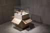 Patricia L. Boyd. Problem of containment, 2025. Moving box, plywood vitrine, prints, jars, drinking glasses, paint. 91 x 87 x 87 cm. Christian Andersen